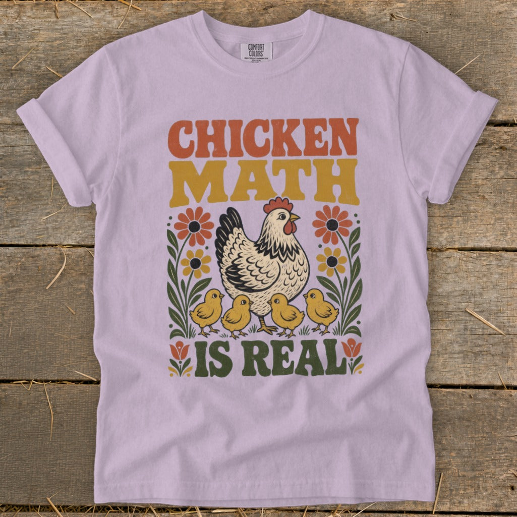 Light purple t-shirt with "Chicken Math is Real" text, chicken, and chicks graphic.