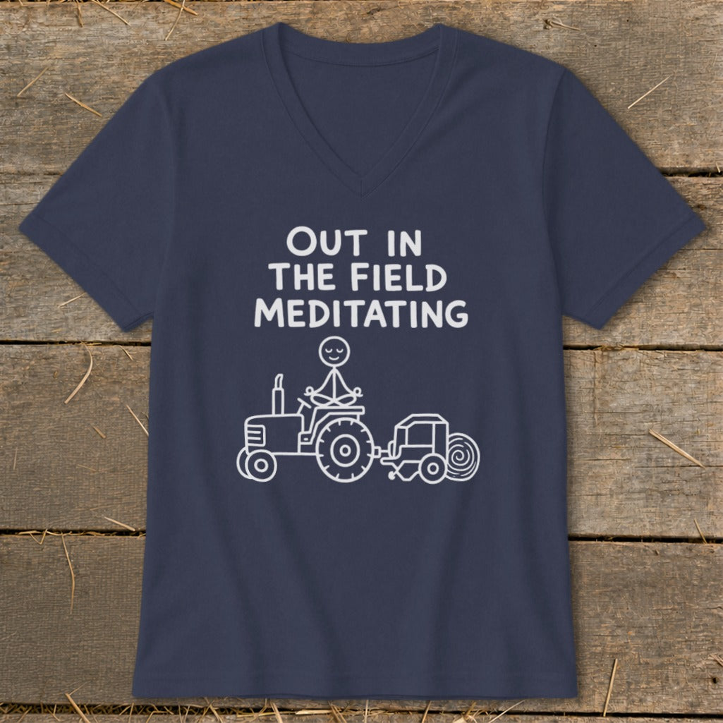 Navy v-neck t-shirt with text "Out in the Field Meditating" and tractor illustration.