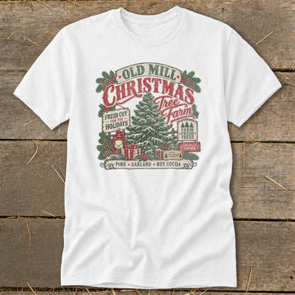 White t-shirt featuring "Old Mill Christmas Tree Farm" graphic with pine trees and gifts.