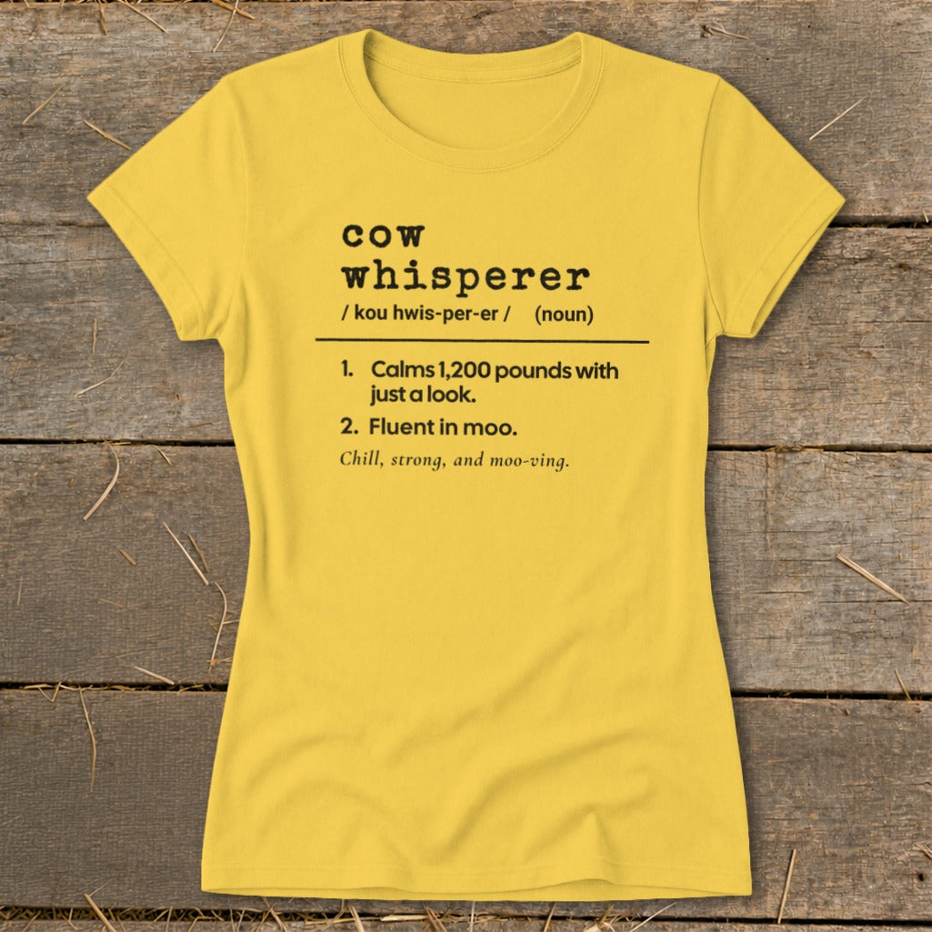 Yellow t-shirt with "Cow Whisperer" definition: Calms 1,200 pounds with just a look. Fluent in moo.