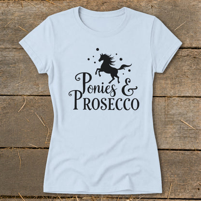 Light blue t-shirt with black graphic of a pony and "Ponies & Prosecco" text.