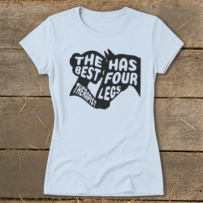Light blue t-shirt with black text and horse head graphic saying "THE BEST THERAPIST HAS FOUR LEGS".