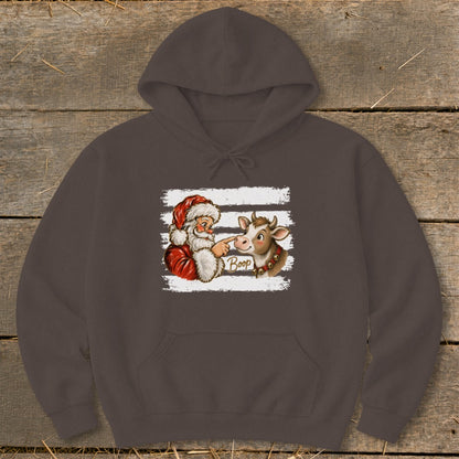 Santa booping a cow's nose with the word "Boop" on a festive graphic.