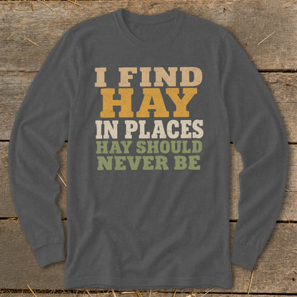 Dark gray long sleeve shirt with "I FIND HAY IN PLACES HAY SHOULD NEVER BE" text.