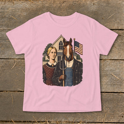 Light pink t-shirt featuring a parody American Gothic graphic with a horse-headed farmer holding a pitchfork.