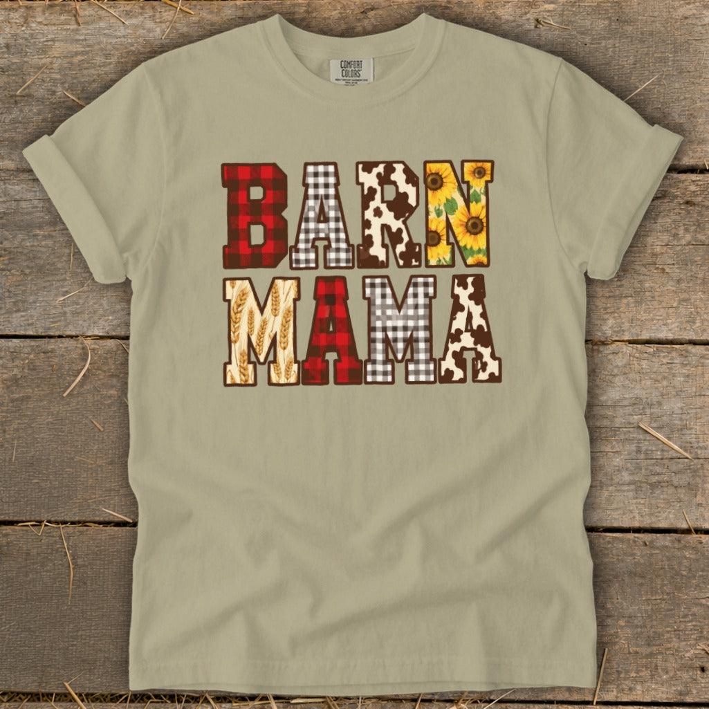 T-shirt with "BARN MAMA" text featuring plaid, cow print, sunflowers, and wheat patterns.