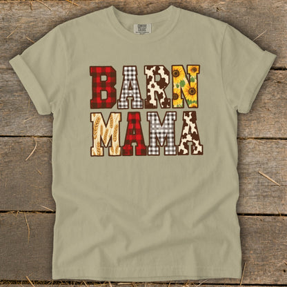 T-shirt with "BARN MAMA" text featuring plaid, cow print, sunflowers, and wheat patterns.