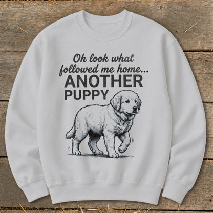 White sweatshirt with sketch of a puppy and text "Oh look what followed me home... ANOTHER PUPPY"