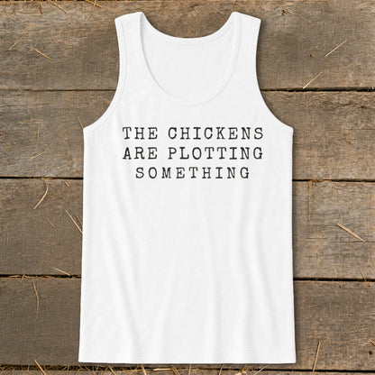 White tank top with black text reading "THE CHICKENS ARE PLOTTING SOMETHING".