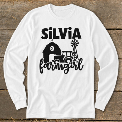 White long sleeve shirt with black "SILVIA farmingirl" text and farm graphics.