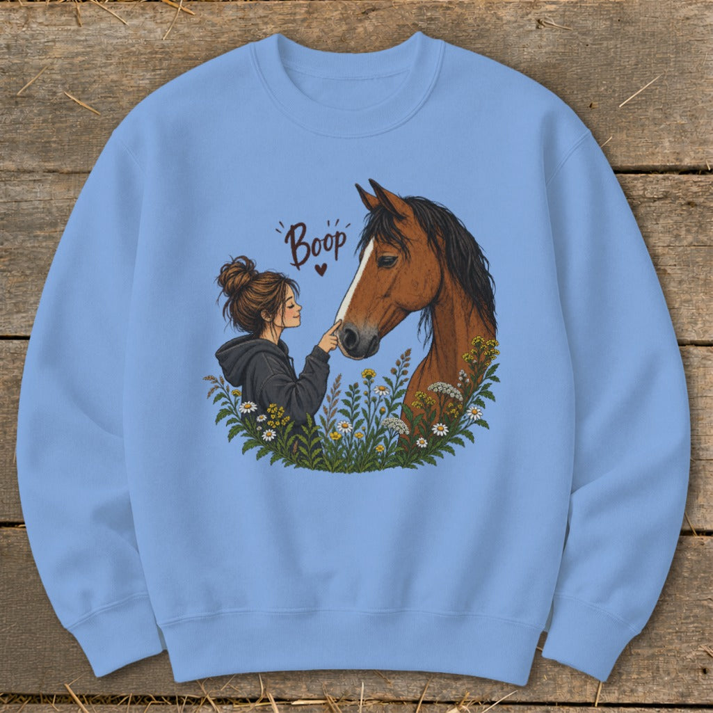 Girl booping horse's nose with "Boop" text above.