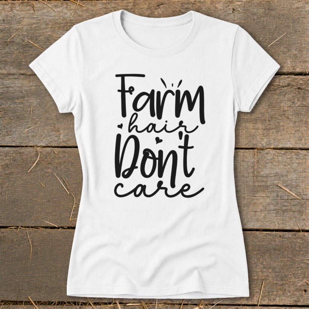 White t-shirt with "Farm hair don't care" text in black cursive font.