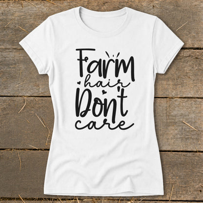 White t-shirt with "Farm hair don't care" text in black cursive font.