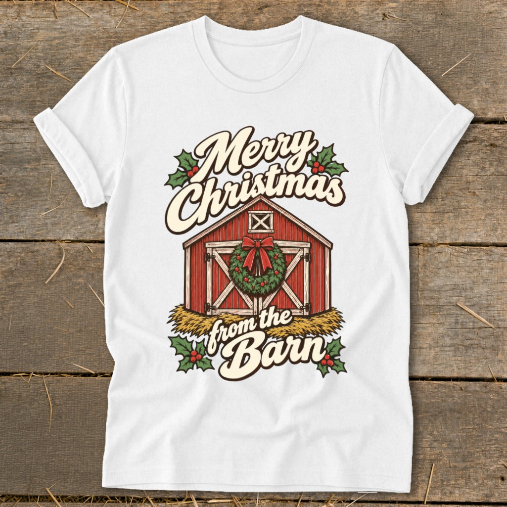 White t-shirt with a graphic of a red barn decorated for Christmas.