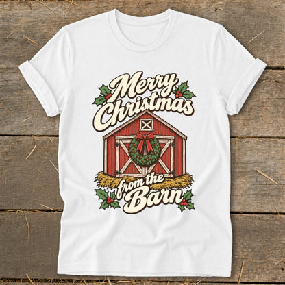 White t-shirt with a graphic of a red barn decorated for Christmas.