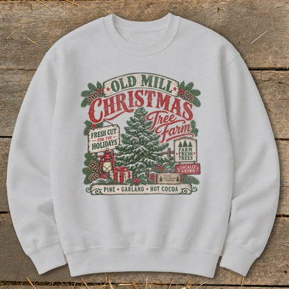 White sweatshirt featuring "Old Mill Christmas Tree Farm" design with festive elements.