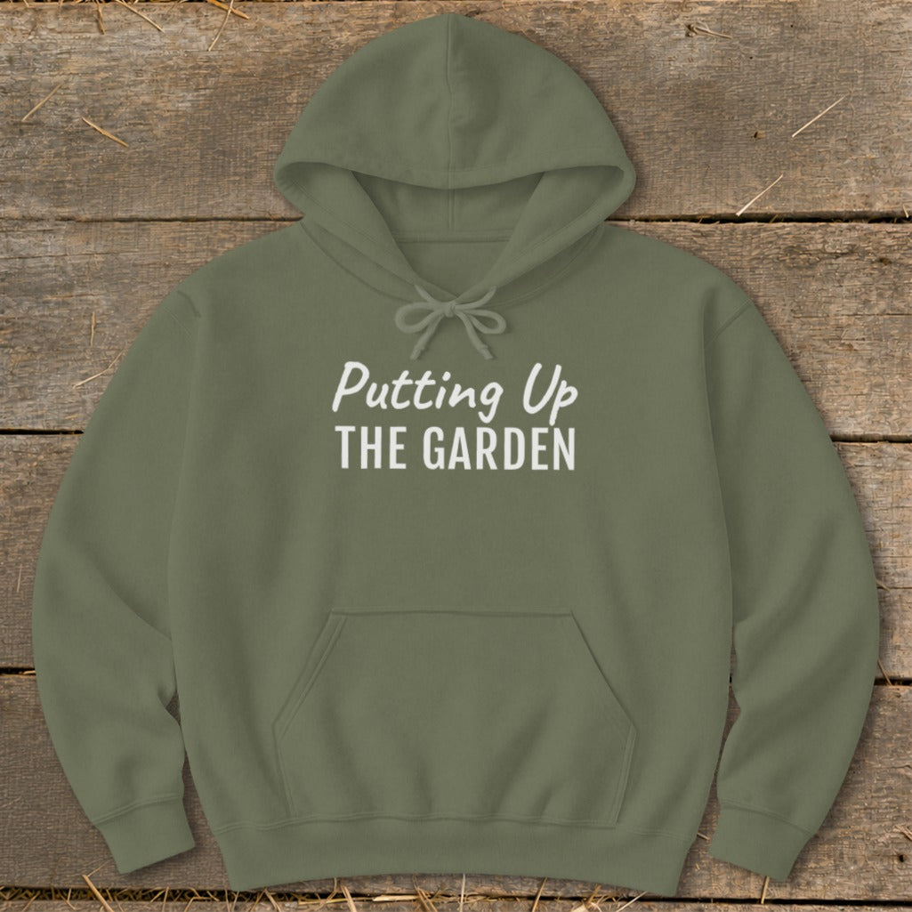 Olive green hoodie with "Putting Up THE GARDEN" printed in white text.