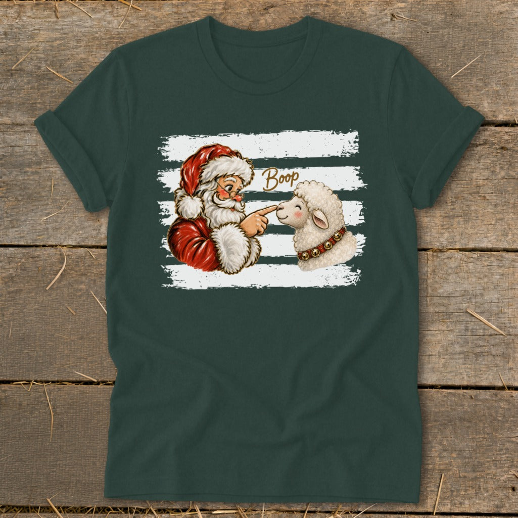 Santa playfully booping a sheep with the word "Boop" on a dark green t-shirt.