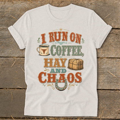 Light grey t-shirt with text "I RUN ON COFFEE, HAY AND CHAOS" and graphics.