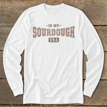 White long-sleeved shirt with "In My Sourdough Era" text design.