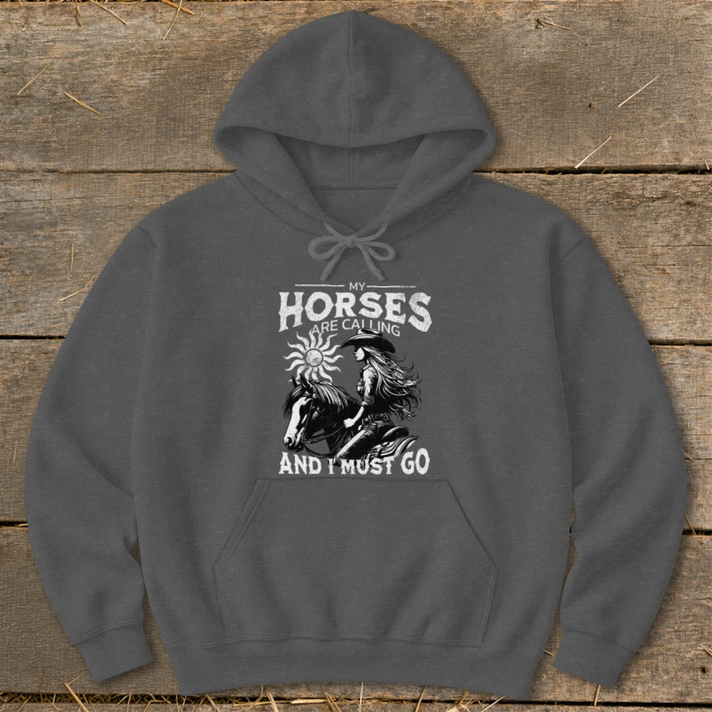 "My Horses Are Calling And I Must Go" graphic on a dark gray hoodie.