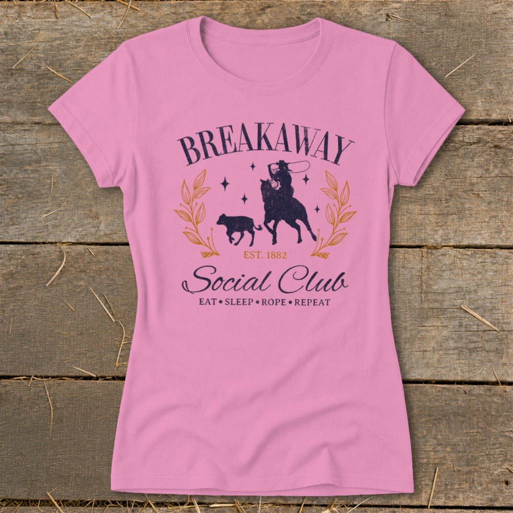 Pink t-shirt with "Breakaway Social Club" text and rodeo graphic.