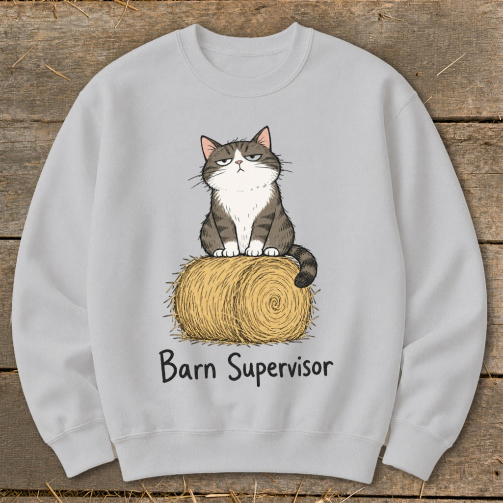 Light grey sweatshirt with cartoon cat sitting on a hay bale, text reads "Barn Supervisor."