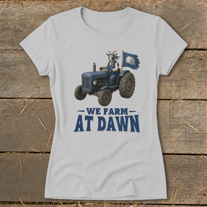 Goat on a blue tractor with flag and text "WE FARM AT DAWN".
