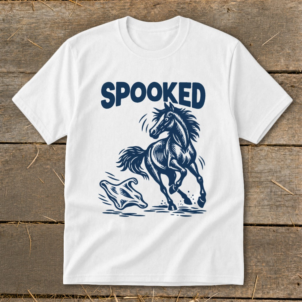 White t-shirt with dark blue graphic of a startled horse and ghost, text "SPOOKED".