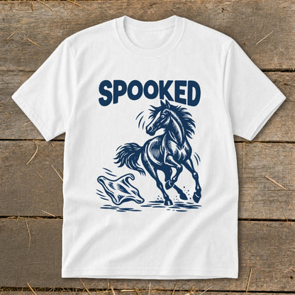 White t-shirt with dark blue graphic of a startled horse and ghost, text "SPOOKED".