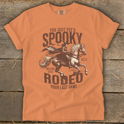 T-shirt graphic with a cowboy on a horse, "Spooky Rodeo," and "Your Last Haw!"