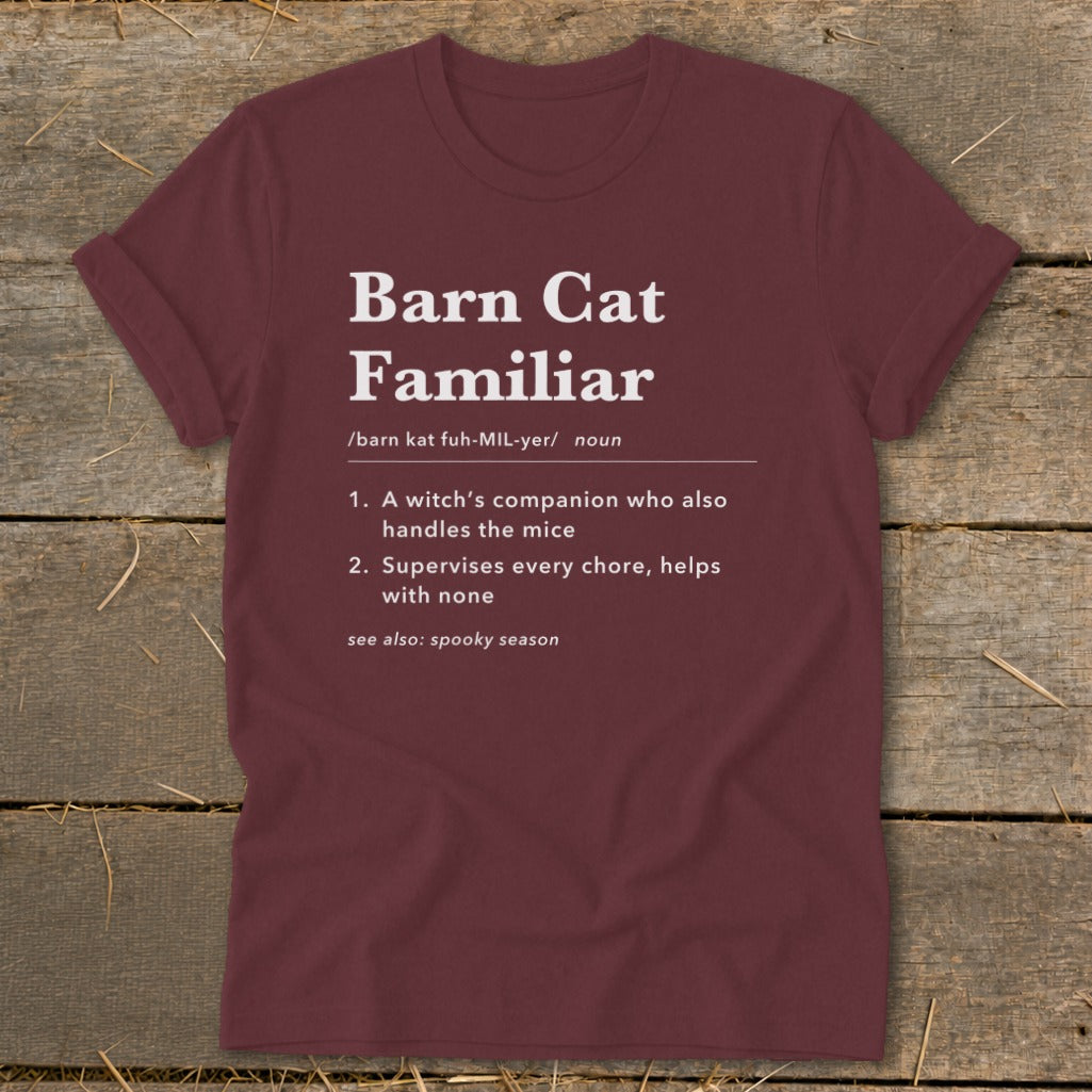 Maroon t-shirt with "Barn Cat Familiar" definition, including pronunciation and descriptive phrases.