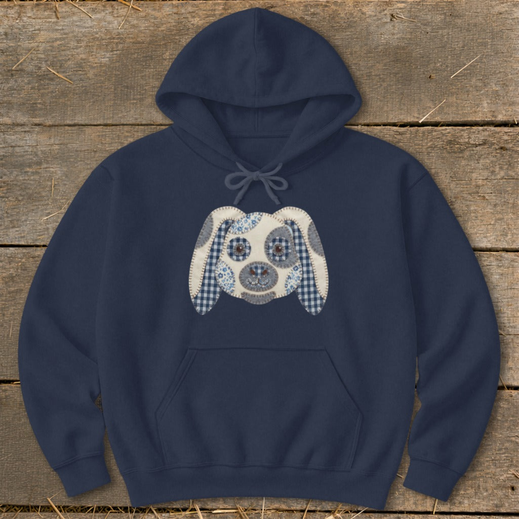 Navy blue hoodie with a patchwork dog face applique on the chest.