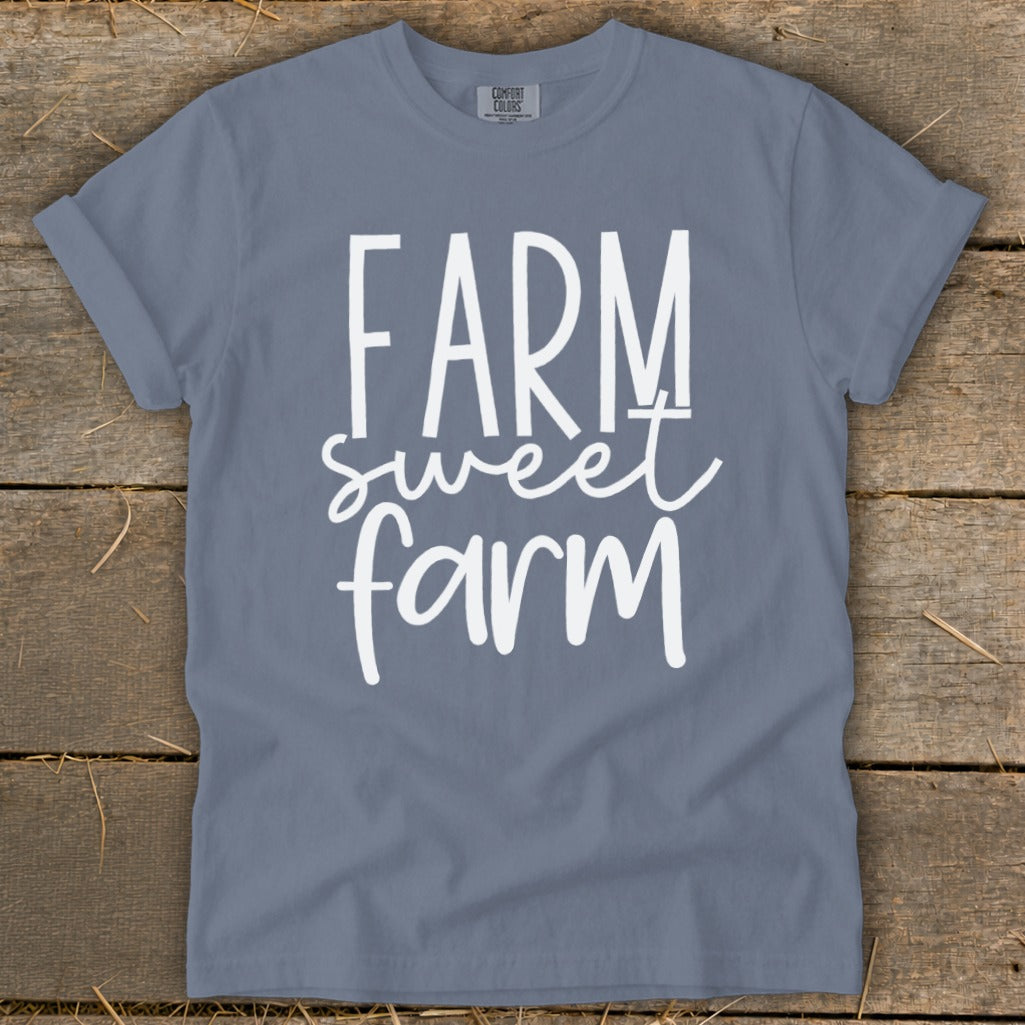 Blue t-shirt with white text "FARM sweet farm" and "COMFORT COLORS" label.