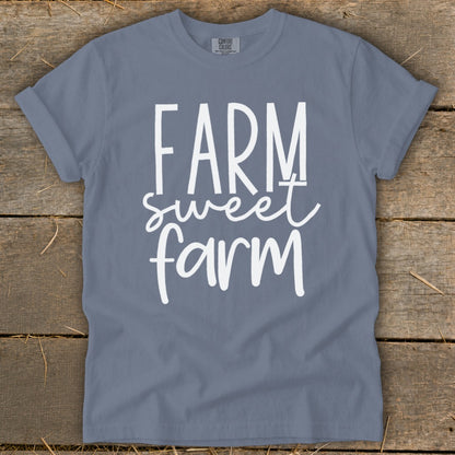 Blue t-shirt with white text "FARM sweet farm" and "COMFORT COLORS" label.