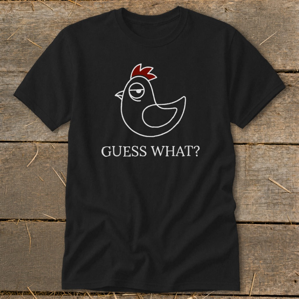 Black t-shirt with a white cartoon chicken and red comb, saying "GUESS WHAT?".