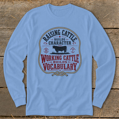 Light blue long sleeve shirt with "Raising Cattle Builds Character" and "Working Cattle Builds Vocabulary" text.