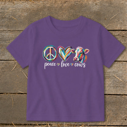 Purple t-shirt with peace, heart, and cow graphic and text peace love cows.