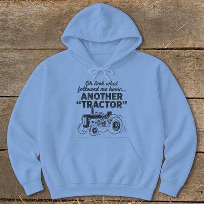Light blue hoodie with text and tractor graphic.