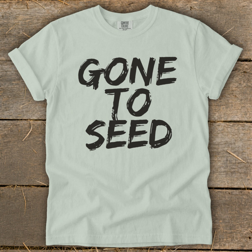 Light green t-shirt with black text that reads "GONE TO SEED".