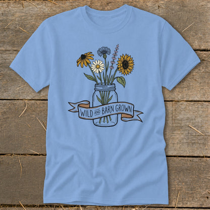 Light blue t-shirt with a mason jar of wildflowers and banner reading "WILD AND BARN GROWN".