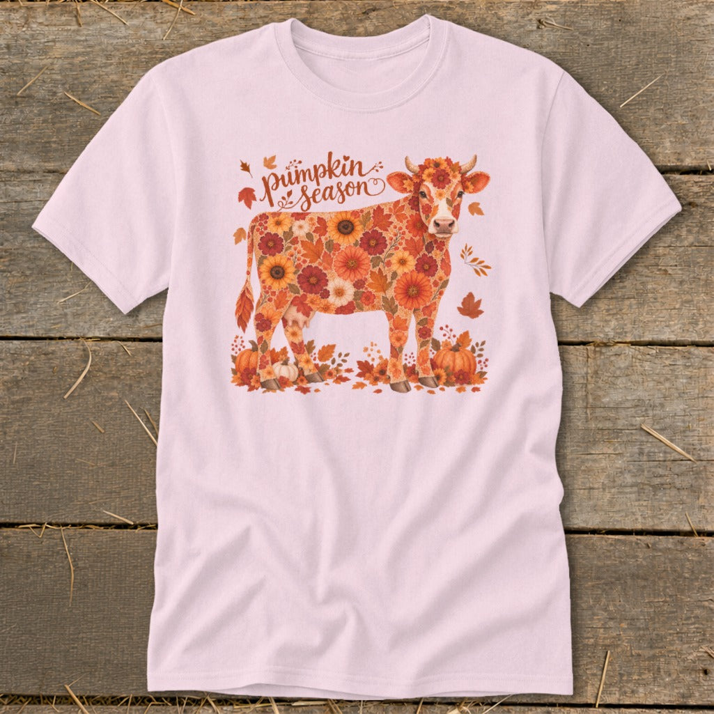 Light pink t-shirt with cow made of autumn flowers, pumpkins, and leaves.