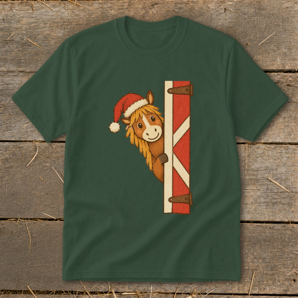 Green t-shirt with a cartoon horse wearing a Santa hat peeking from behind a barn door.
