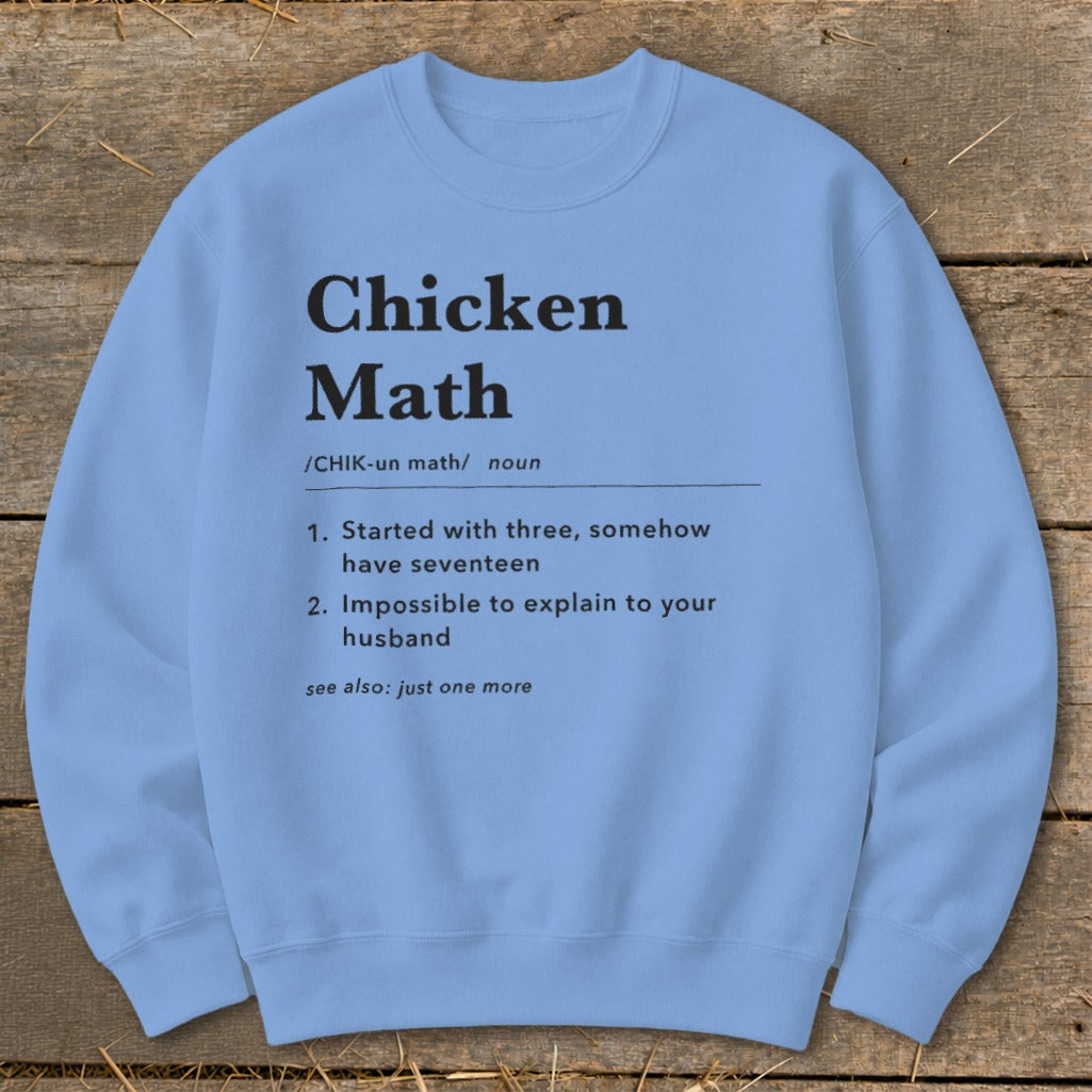 Light blue sweatshirt with "Chicken Math" definition printed in black.