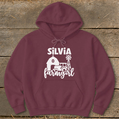 Maroon hoodie with white "SILVIA farmgirl" text and farm graphics.