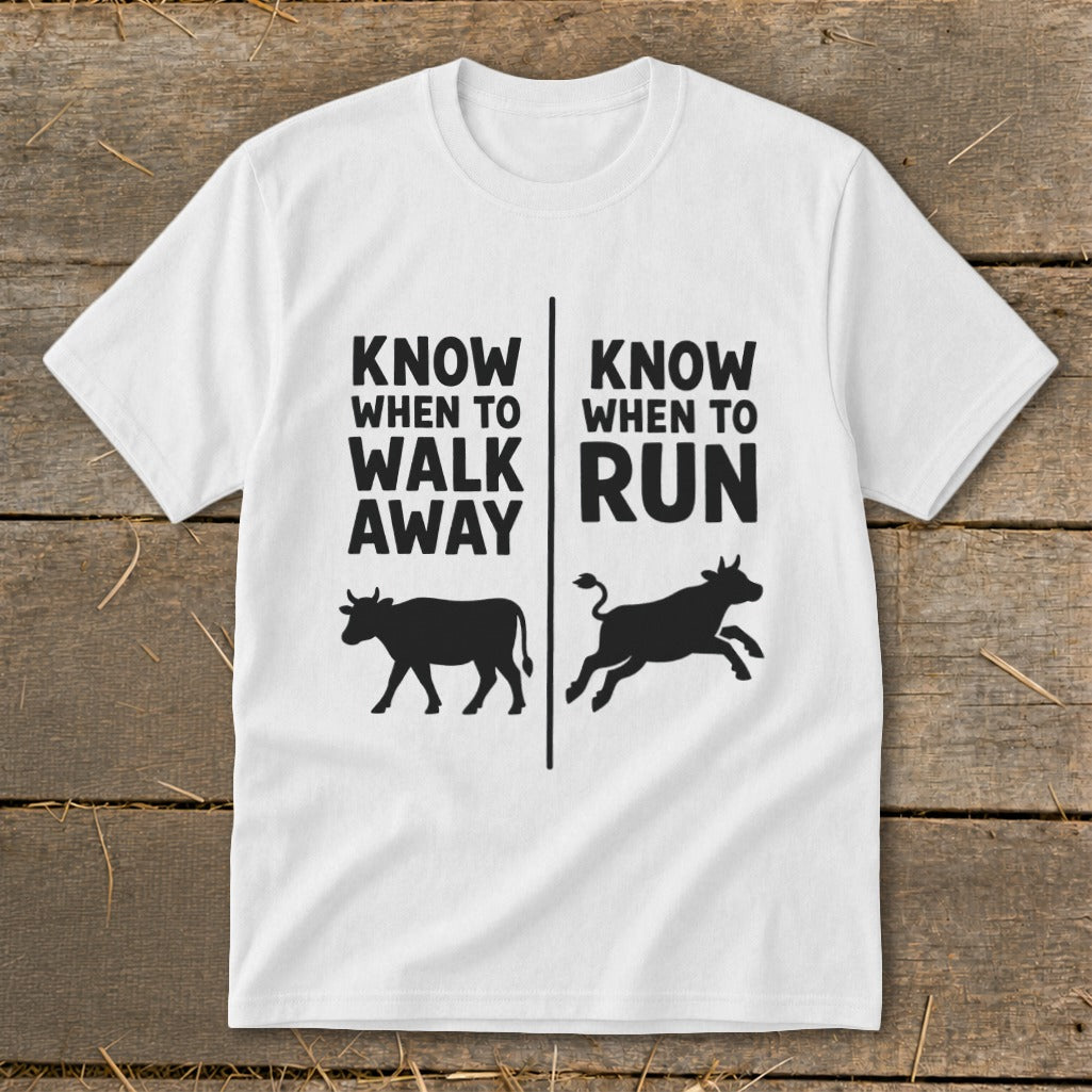 White t-shirt with "Know When to Walk Away" and a walking cow, and "Know When to Run" with a running cow.