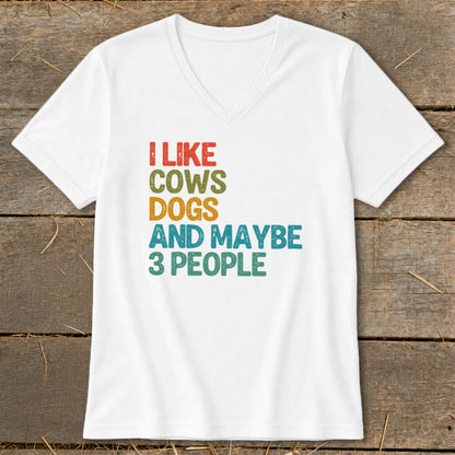 White v-neck t-shirt with text "I like cows, dogs and maybe 3 people".