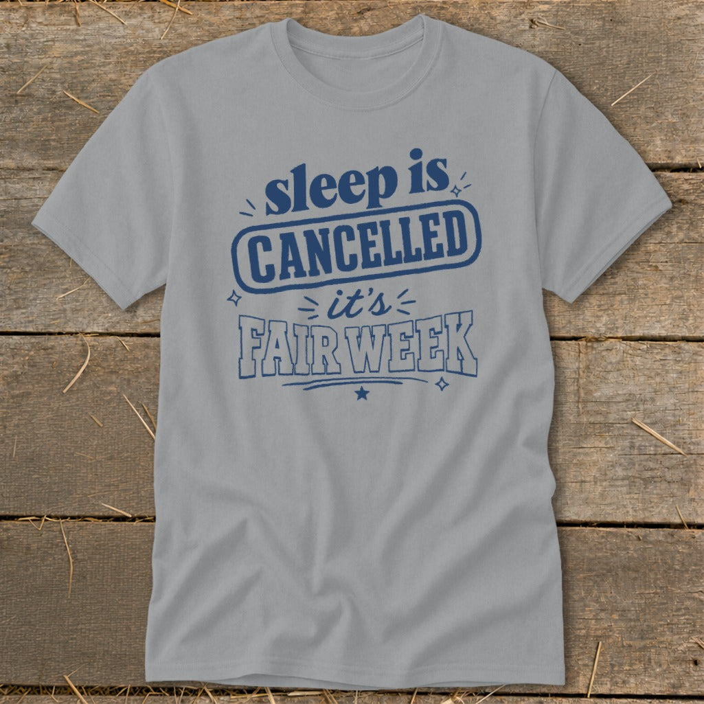 Grey t-shirt with blue text reading "sleep is CANCELLED it's FAIR WEEK".