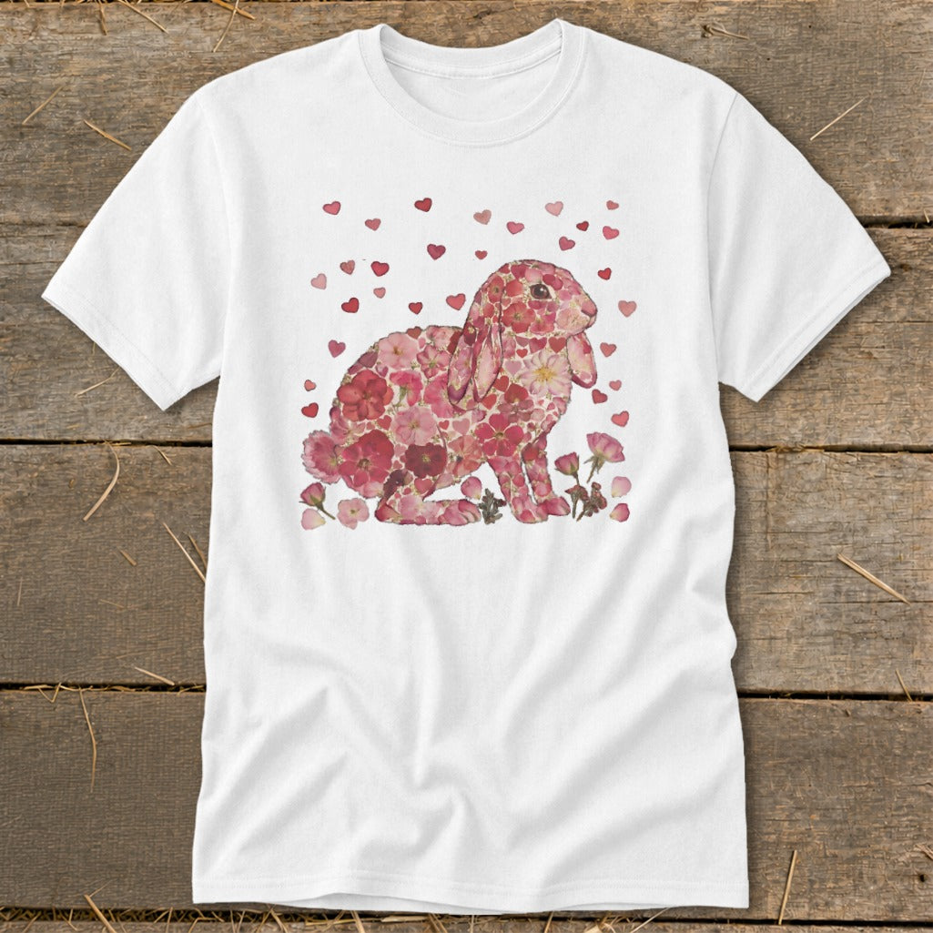 White t-shirt with a pink floral bunny and falling hearts design.