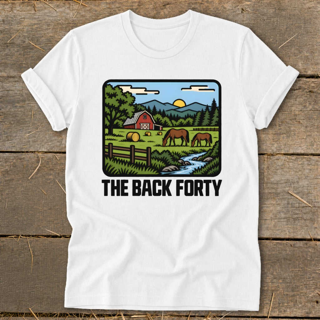 A white t-shirt featuring a retro cartoon illustration of a farm scene with horses, a barn, and the text THE BACK FORTY.